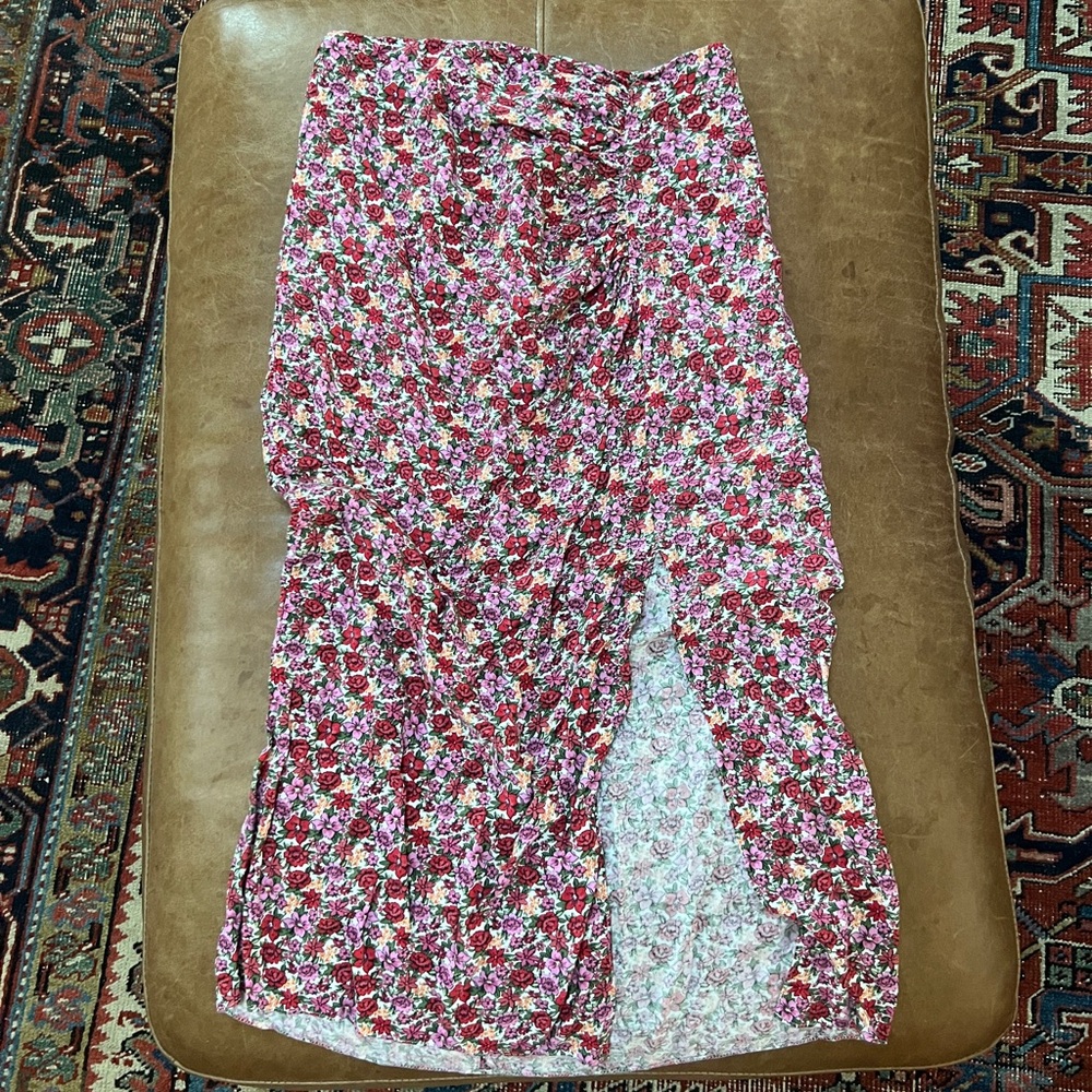 Pink floral midi skirt with a flowy design